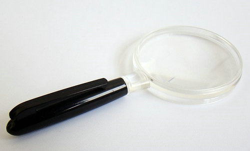 Magnifier with plastic lens